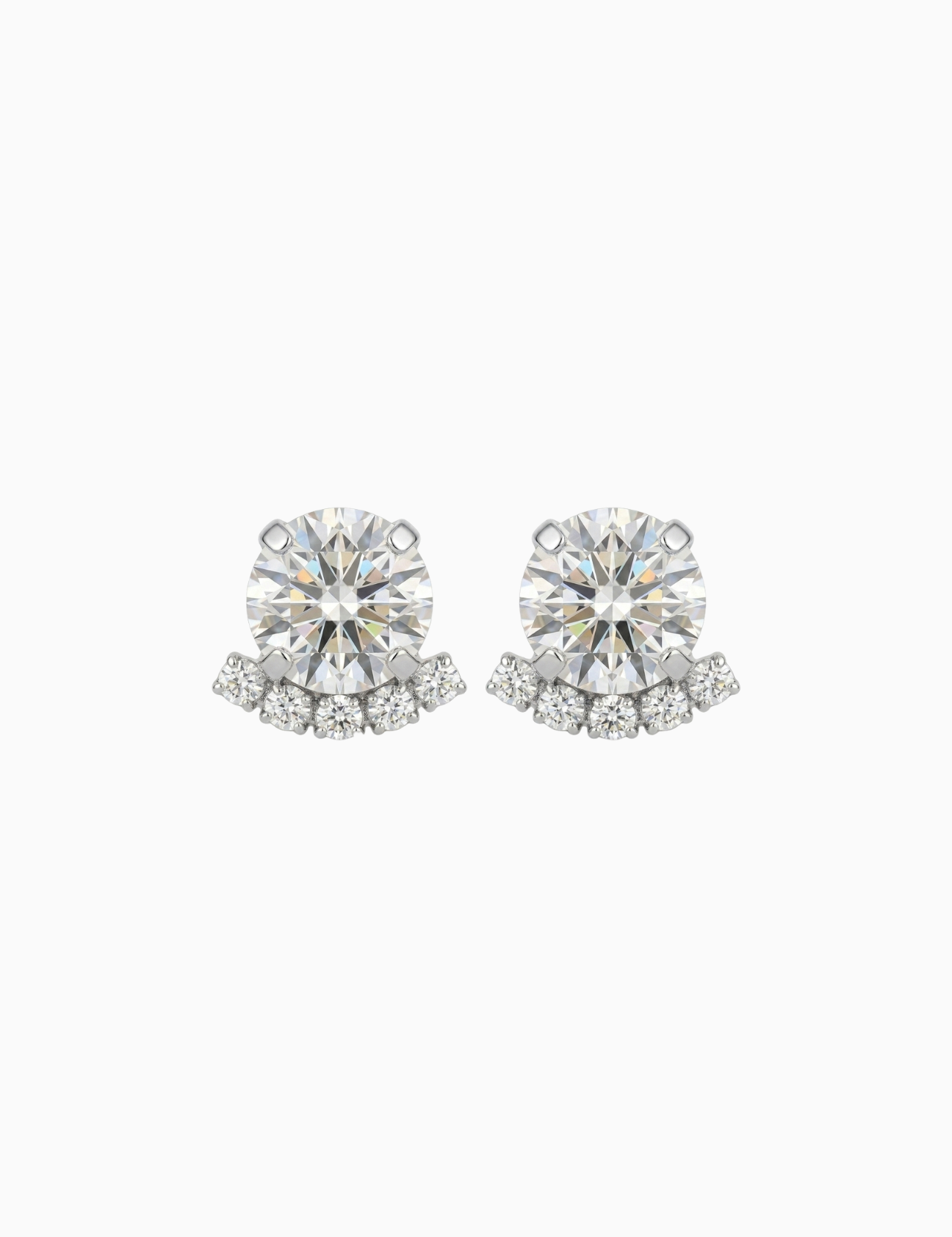 Pair of diamond stud earrings on a white background