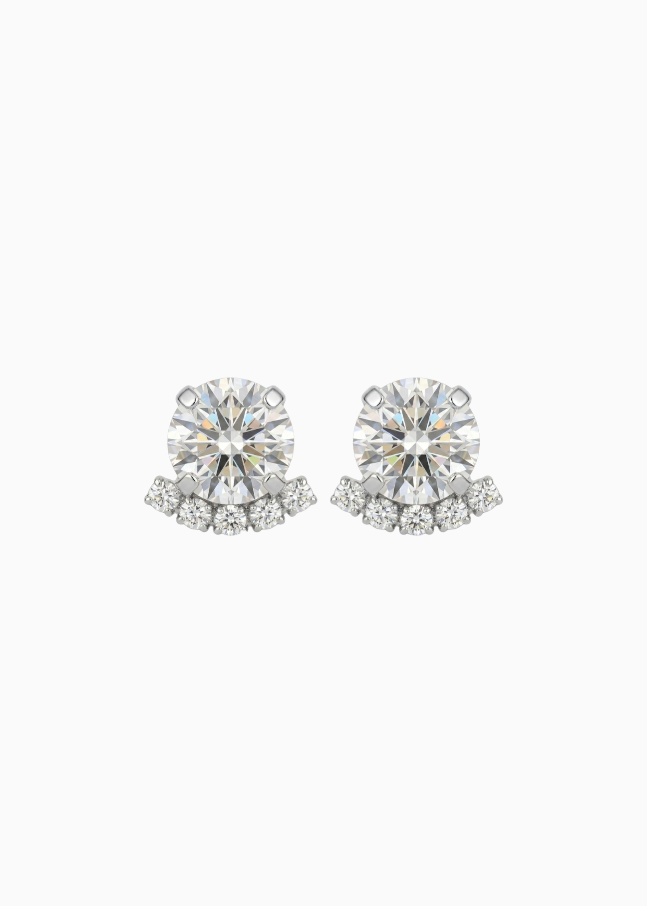 Pair of diamond stud earrings on a white background