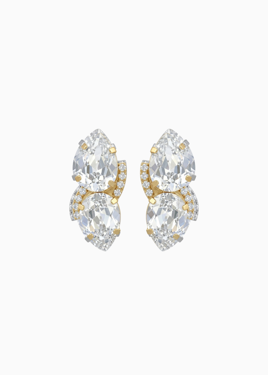 Pair of gold and clear crystal earrings on a white background