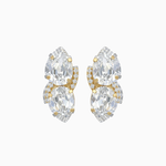 Pair of gold and clear crystal earrings on a white background