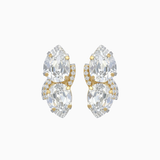 Pair of gold and clear crystal earrings on a white background