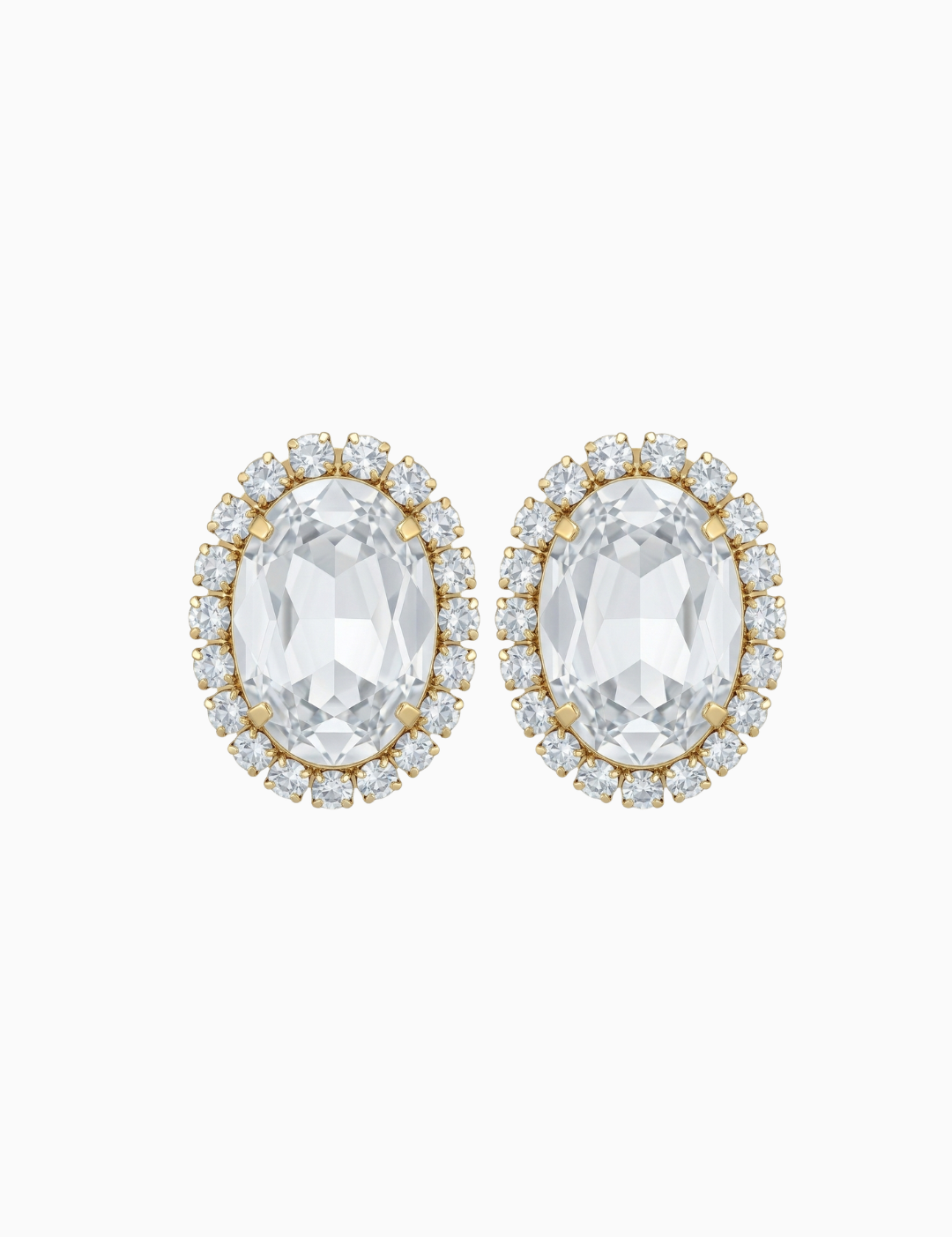 Pair of earrings with clear gemstones and gold accents on a white background