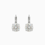 Pair of silver leverback hoop earrings with clear gemstones on a white background