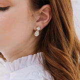 bridal earrings
wedding jewelry
teardrop earrings
wedding accessories
fine jewelry
elegant bridal style
bride jewelry
wedding sparkle
bridal accessories
timeless wedding style
wedding day jewelry
jewelry for brides
classic wedding look
bridal elegance
luxury wedding jewelry
wedding inspiration
wedding fashion
statement earrings for brides
wedding day details
jewelry for weddings