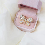 Petunia crystal butterfly brooch by Sarah Gauci, with hand-set crystals and gold-plated detailing.